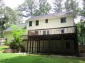 Backyard featuring a spacious deck, showcasing the outdoor living space of the home at 340 Sherwood Se Cir, Conyers, GA 30094
