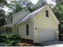 Exterior side view of a home showcasing the attached garage, clean lines, and well-maintained siding at 340 Sherwood Se Cir, Conyers, GA 30094