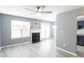 Cozy living area with modern floors, a fireplace, and plenty of natural light at 6726 Gallant Se Ct # 30, Mableton, GA 30126