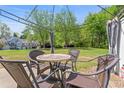 Inviting patio area features comfortable seating under a pergola and lush green surroundings, ideal for relaxing at 949 Pike Forest Dr, Lawrenceville, GA 30045
