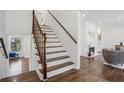 Elegant staircase with white risers and dark wood treads and railings at 335 Amberidge Nw Trl, Atlanta, GA 30328