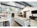 Bright open living room with vaulted ceilings, hardwood floors, and exposed beams at 225 Jayne Ellen Way, Alpharetta, GA 30009