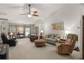 Spacious living room featuring high ceilings, a ceiling fan, and ample seating at 1889 Raegan Way, Lawrenceville, GA 30043