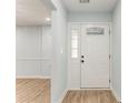 Bright entryway with a decorative front door, light walls, and modern flooring at 7074 Babbling Brook Dr, Jonesboro, GA 30236