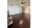 Spacious living room featuring hardwood floors, high ceilings, and a decorative fireplace at 955 Tributary Way, Dacula, GA 30019