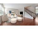 Bright living room with a staircase, hardwood floors, neutral paint, and modern furnishings at 290 Lakemoore Ne Dr # C, Atlanta, GA 30342