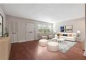 Bright living room with hardwood floors and a seating area with elegant decor at 290 Lakemoore Ne Dr # C, Atlanta, GA 30342