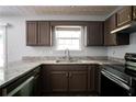 Updated kitchen boasts granite countertops, stainless steel appliances, and ample cabinet space at 5538 Pineridge Ct, Forest Park, GA 30297