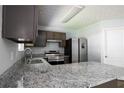 Updated kitchen features granite counters and stainless appliances at 5538 Pineridge Ct, Forest Park, GA 30297
