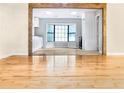 Open dining area with hardwood floors, natural light, and a view into the kitchen at 468 Watson Ferry Dr, Forest Park, GA 30297