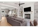 Cozy living room features a fireplace, mounted TV, and integrated shelving at 717 Lenox Ln, Atlanta, GA 30324