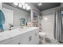 Traditional bathroom with a single sink vanity, shower-tub combination, and neutral decor at 11352 Musette Cir, Alpharetta, GA 30009