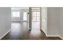 The living space showcases new hardwood floors, fresh paint, and access to a private outdoor balcony at 795 Hammond Dr # 503, Sandy Springs, GA 30328