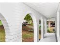 Spacious covered porch area with white brick arches, perfect for outdoor seating at 3530 Turner Heights Dr, Decatur, GA 30032