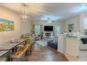 Open-concept living room featuring hardwood floors, a fireplace, and views of the kitchen at 1311 Primrose View Cir, Lawrenceville, GA 30044