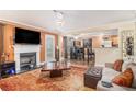 Comfortable living room with fireplace open to dining area and kitchen, perfect for entertaining at 2437 Charleston Pointe Se Ct, Atlanta, GA 30316