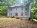 Traditional two story home featuring double hung windows and a welcoming entryway at 408 Hasty Trl, Canton, GA 30115