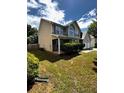View of the house highlighting the side and back of the home plus lawn at 7178 Glaspie Way, Atlanta, GA 30349