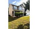 Two-story home with covered porch and two car garage at 7178 Glaspie Way, Atlanta, GA 30349