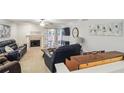 Spacious living room with a fireplace and sliding doors to a patio area offering indoor and outdoor living at 67 Middleton Se Ct, Smyrna, GA 30080