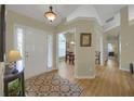 Inviting foyer with hardwood floors and views into the dining room and other living spaces at 2145 Charleston Oak Cir, Lawrenceville, GA 30043