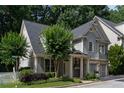Charming home with landscaped front yard, two-car garage and inviting entryway at 1360 Edmund Ne Ct, Atlanta, GA 30306