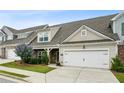 Beautiful home showcases stone accents, well-manicured landscaping, and a convenient two-car garage at 1637 Short Shadow Ln, Snellville, GA 30078