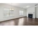Spacious living room with hardwood floors and fireplace at 1637 Short Shadow Ln, Snellville, GA 30078