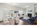 Bright living room with dining area and a fireplace at 1637 Short Shadow Ln, Snellville, GA 30078