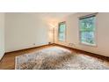 A bedroom featuring hardwood floors and two windows at 2867 Holly Oaks Dr, Marietta, GA 30062