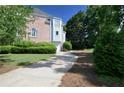 Home exterior with a winding driveway and lush green landscaping at 3071 Intrepid Wake, Marietta, GA 30062