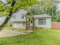 Charming home featuring a split level, front yard, and traditional architecture at 4728 Garden Hills Dr, Stone Mountain, GA 30083