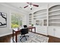 Home office space showcasing custom built-in shelves and a modern desk setup at 1220 Roswell Manor Cir, Roswell, GA 30076