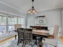 Cozy dining room showcasing wood table, chairs, and large windows with natural light at 3845 Lake Lanier Dr, Duluth, GA 30097