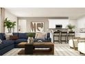 Open-concept living room with a blue sofa, white accents, and a stylish decor at 1437 Hunter Trl, Acworth, GA 30102