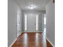 Inviting entryway with hardwood floors and a front door with sidelights at 420 Spring Lake Ter, Covington, GA 30016