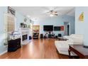 Bright living room with a vaulted ceiling, fireplace, and light blue walls at 580 Lilburn School Rd, Lilburn, GA 30047