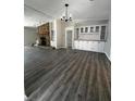 Open-concept living space with ample natural light, built-in storage, and stylish flooring at 6830 Pawnee Trl Se, Acworth, GA 30102