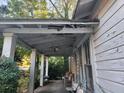Covered porch with decorative columns and seating area to relax on at 2880 Elizabeth Se St, Smyrna, GA 30080