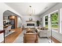 Spacious living room with hardwood floors, open to dining and kitchen areas at 2244 Alpha Dr, Decatur, GA 30032