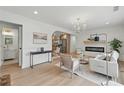 Bright living room featuring a modern fireplace, hardwood floors, and stylish decor at 2244 Alpha Dr, Decatur, GA 30032