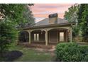 Inviting covered back porch with arched columns, offering a relaxing outdoor living space at 3405 Glenrose Trail Trl, Atlanta, GA 30341