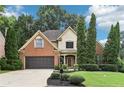 Beautiful home featuring a well-maintained lawn, mature trees, and a brick and siding facade at 3405 Glenrose Trail Trl, Atlanta, GA 30341