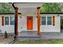 Close up of front porch with orange door, cedar posts, and address at 737 Bolton Nw Rd, Atlanta, GA 30331