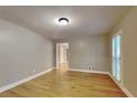 Bedroom with hardwood floors, neutral paint, and natural light at 247 Millbrook Farm Rd, Marietta, GA 30068