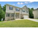 Attractive two-story home with a combination of brick and siding exterior at 1630 Eaglerock Dr, Suwanee, GA 30024