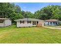Charming single-story home with a well-maintained lawn and inviting curb appeal at 2049 Phillips Dr, Atlanta, GA 30315