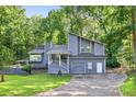 Charming two-story home with an attached garage and a well-maintained front yard at 3328 Hidden Bluff Trl, Snellville, GA 30039