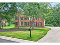 Beautiful brick home with well-maintained landscaping and a long driveway at 2020 Ridge Gate Drive Dr, Cumming, GA 30041