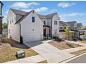 Beautiful two-story home featuring an attached two-car garage and a well-maintained front lawn at 117 Villanueva Rd, Woodstock, GA 30188